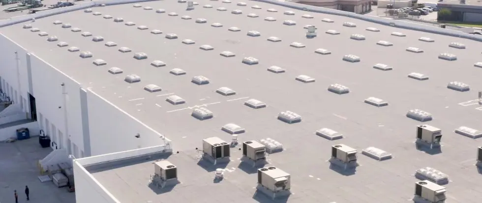 Flat roof with multiple ventilation systems