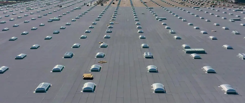 Expansive rooftop featuring multiple skylights