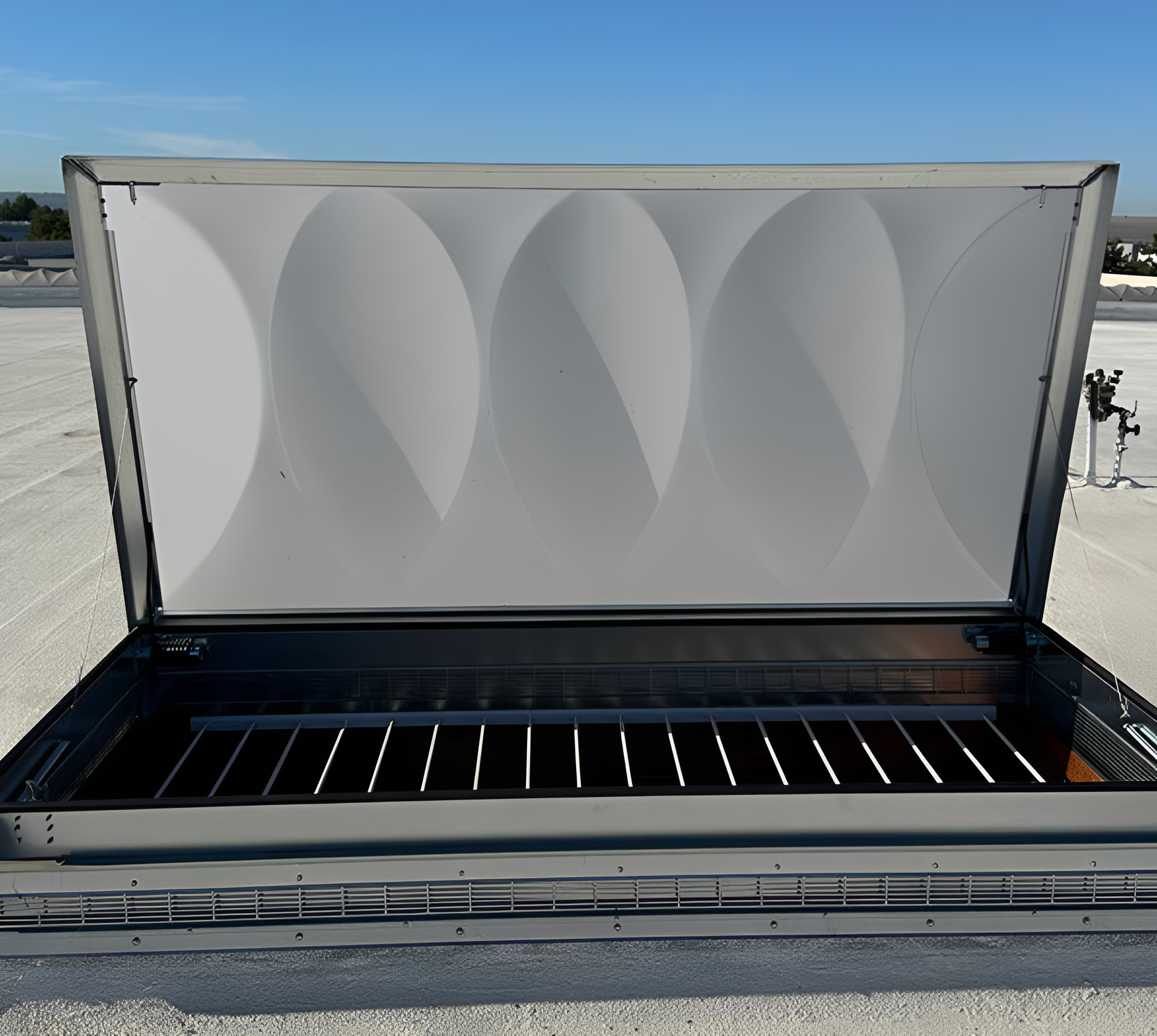 Open rooftop access hatch with clear sky.
